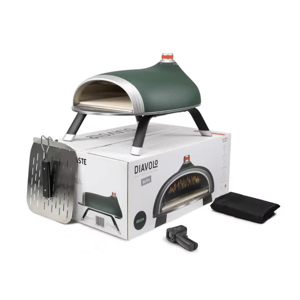 Kompakt, zöld színű Diavolo pizzakemence dobozával, sütőlapáttal, gázcsatlakozóval és fekete huzattal, kültéri és asztali használatra.